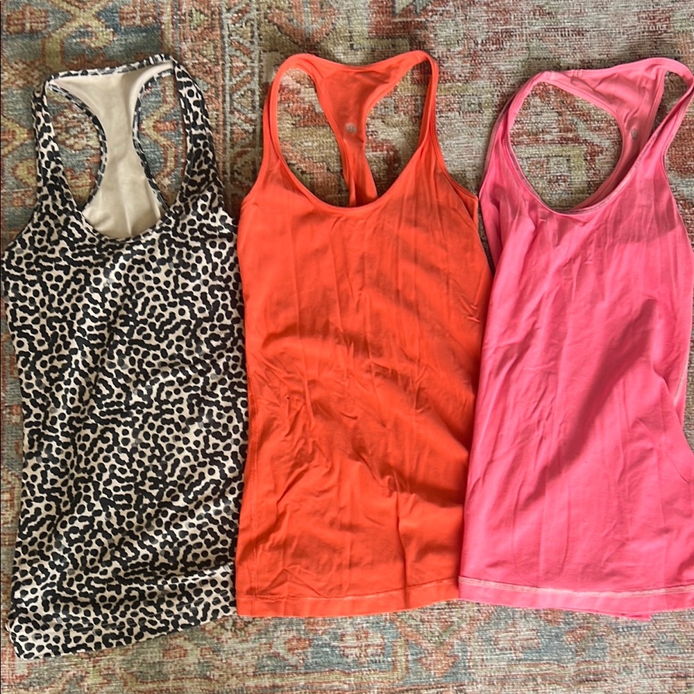 Lululemon Racerback Tanks- lot of 3, size 6. Leopard, Orange, Pink/white stripe